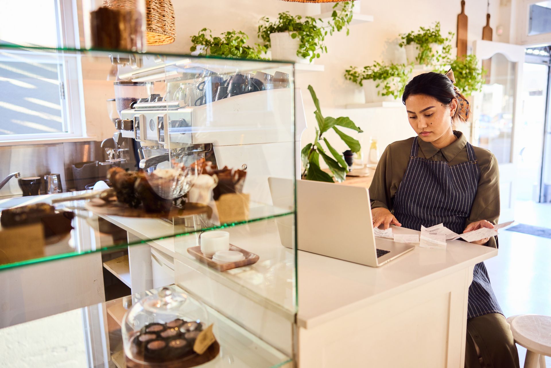 Woman managing accounts and organising receipts for a professional business accounting service.