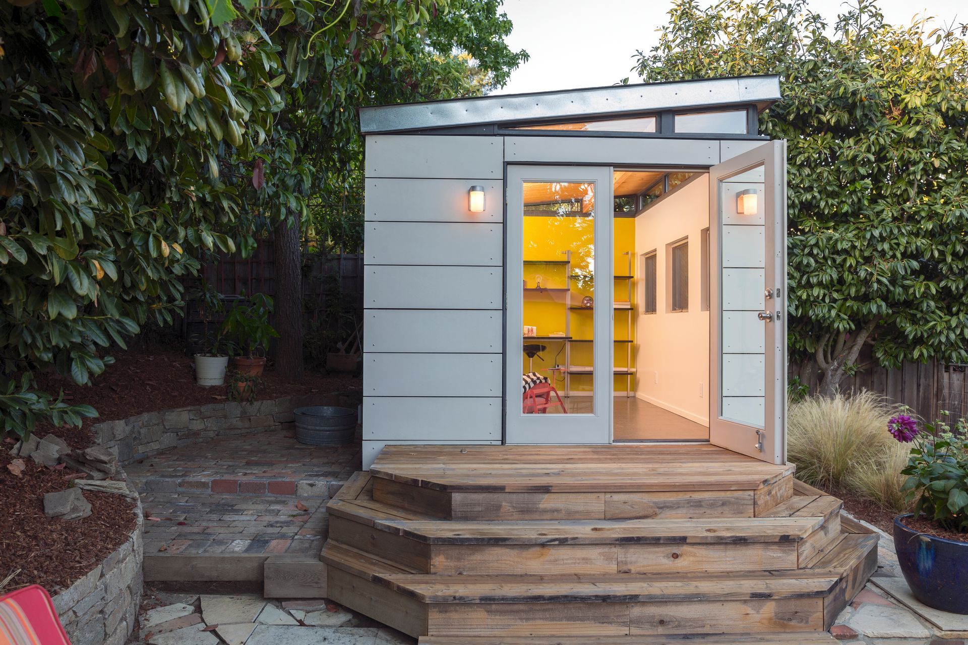 A small shed with stairs leading up to it