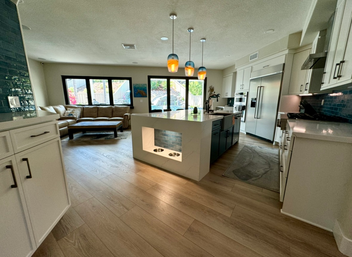 A kitchen with a large island in the middle of the room.