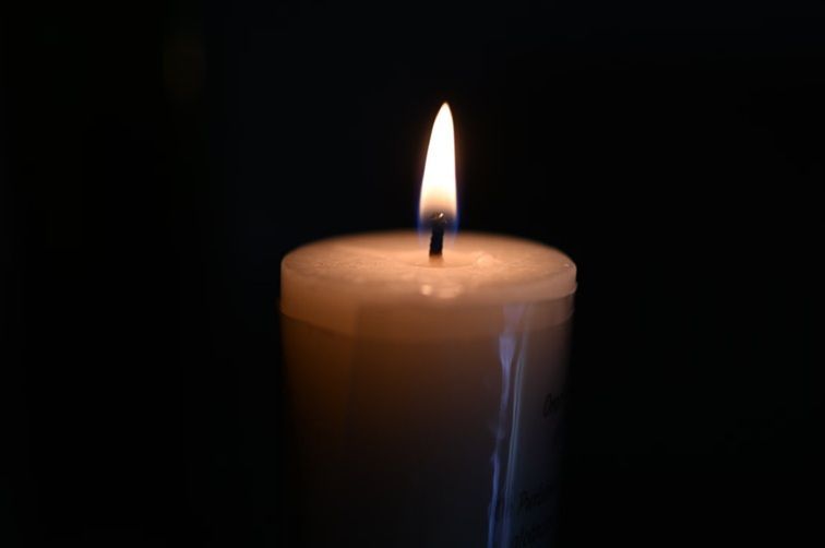 Burning memorial candle representing funeral homes in Cedarburg, WI.