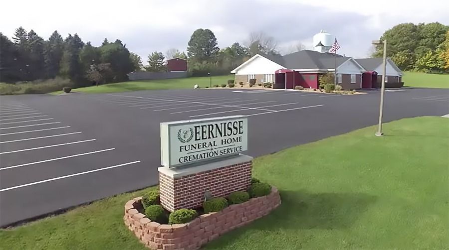 Exterior view of Eernisse Funeral Homes & Cremation Service with a welcoming facility and spacious parking area