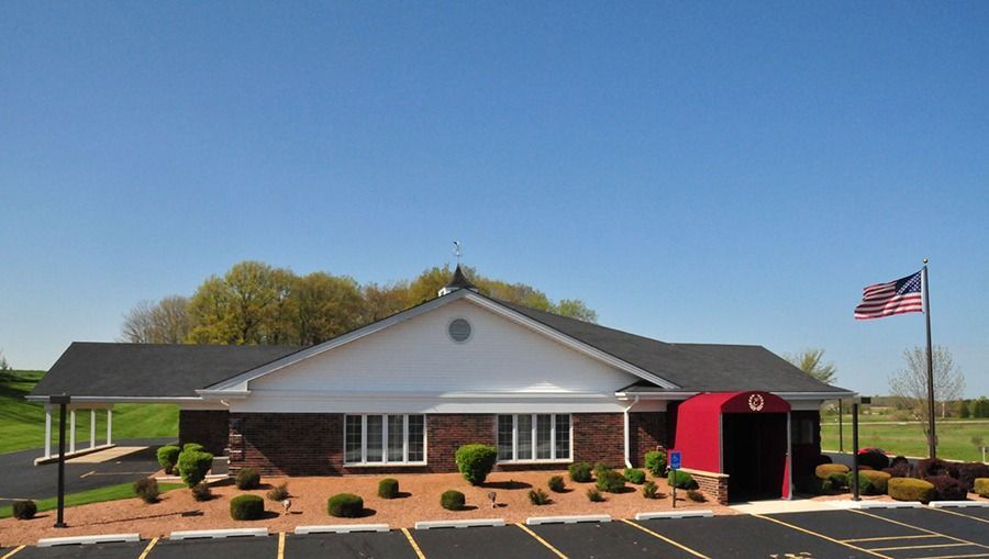 Welcoming entrance of Eernisse Funeral Homes & Cremation Service with a bright facade and peaceful surroundings