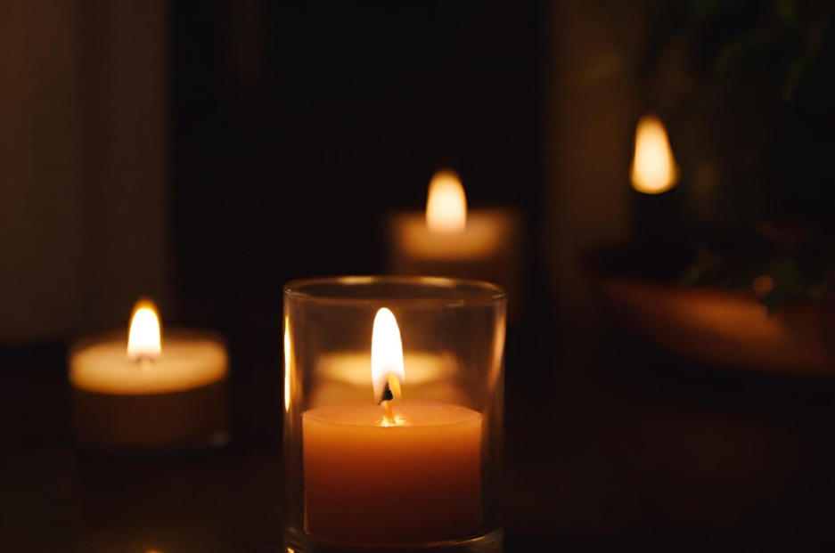 Several lit candles creating an intimate setting for remembrance in Cedarburg, WI.