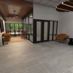 Modern entrance with light flooring, glass walls, and wood accents. Includes seating areas.