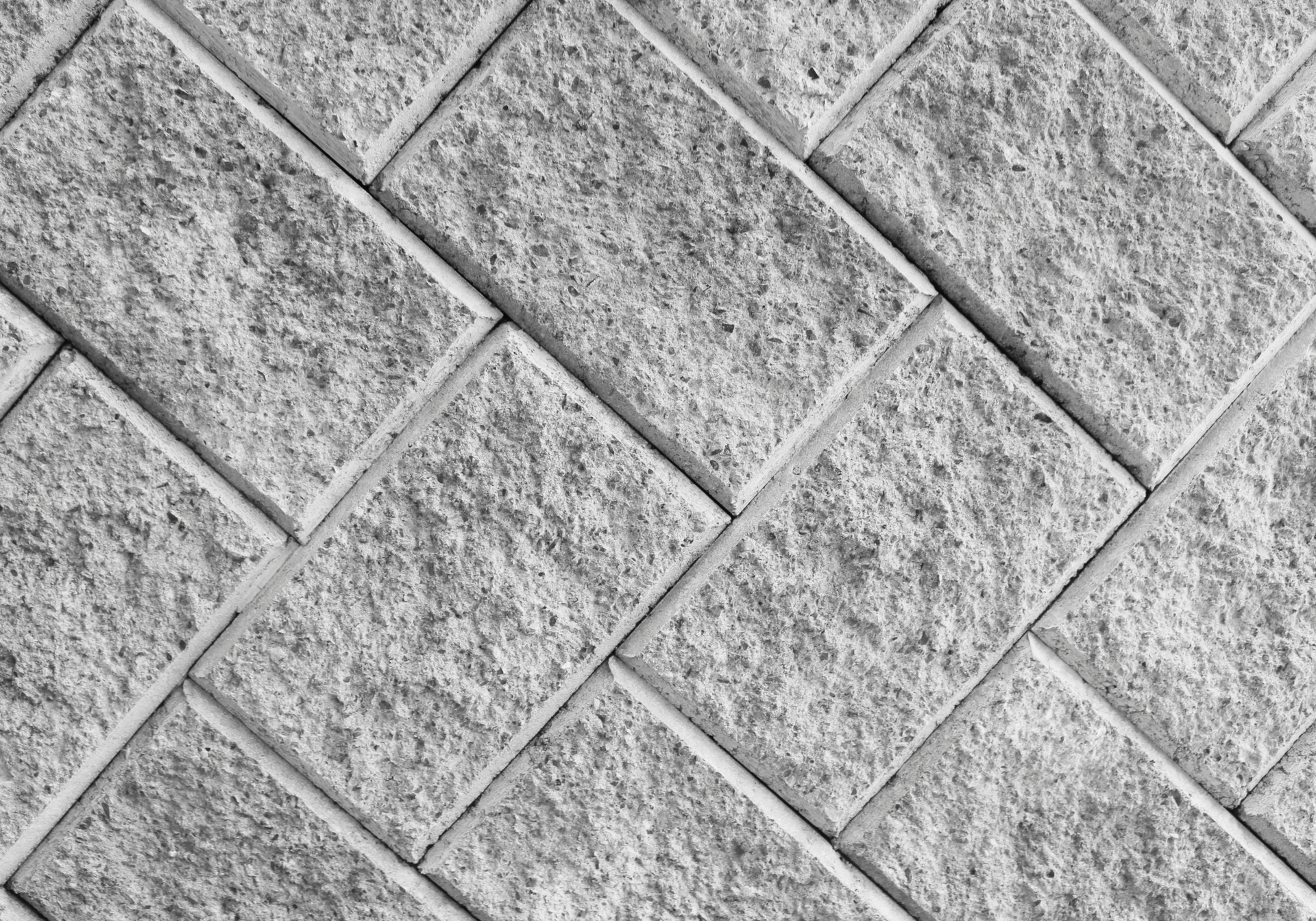 A black and white photo of a brick wall.