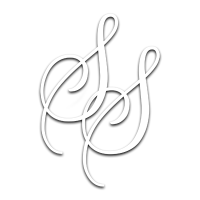 Interlocking white cursive monogram initials on a light gray background