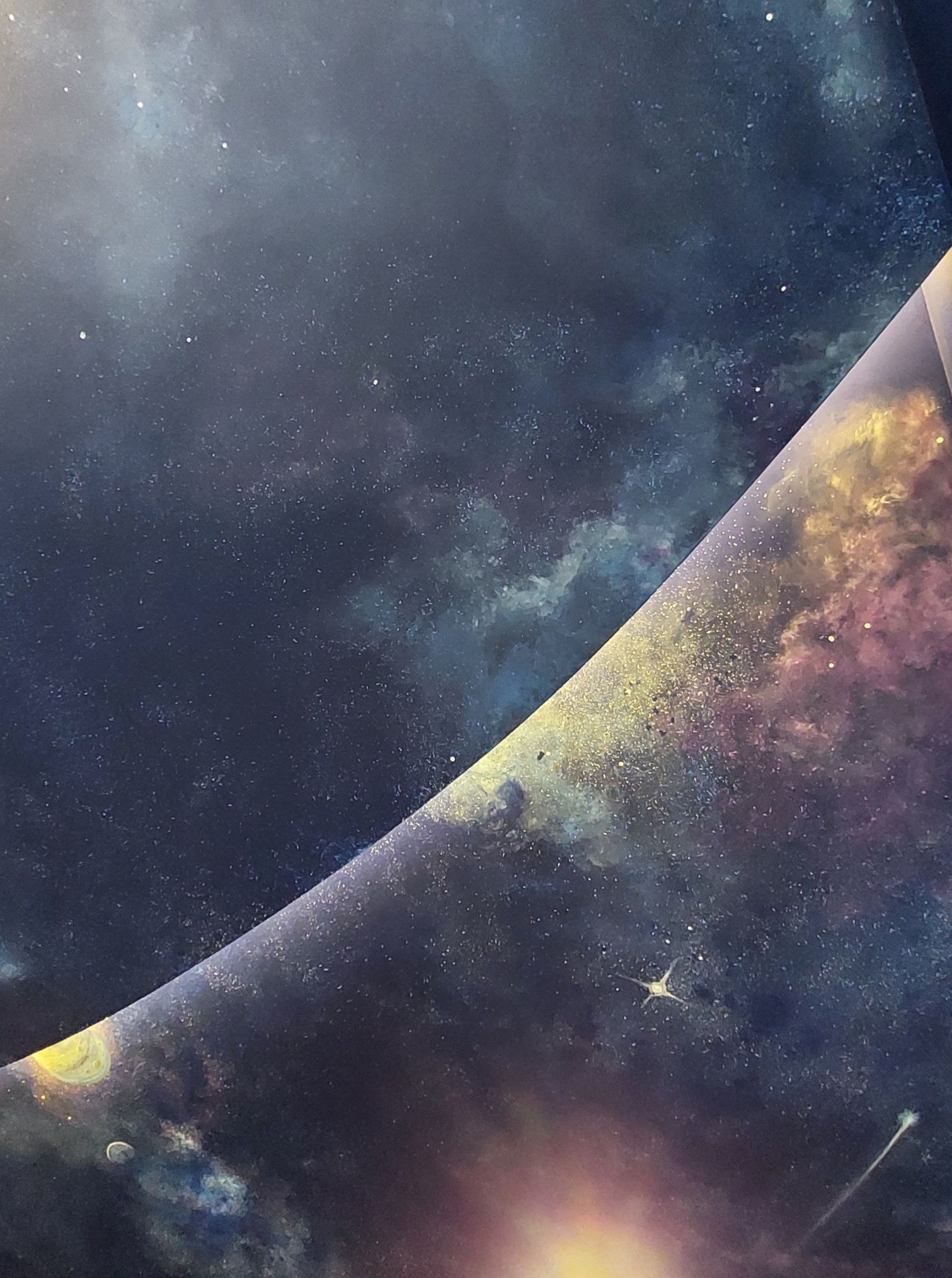 A painting of a planet in space with a galaxy in the background