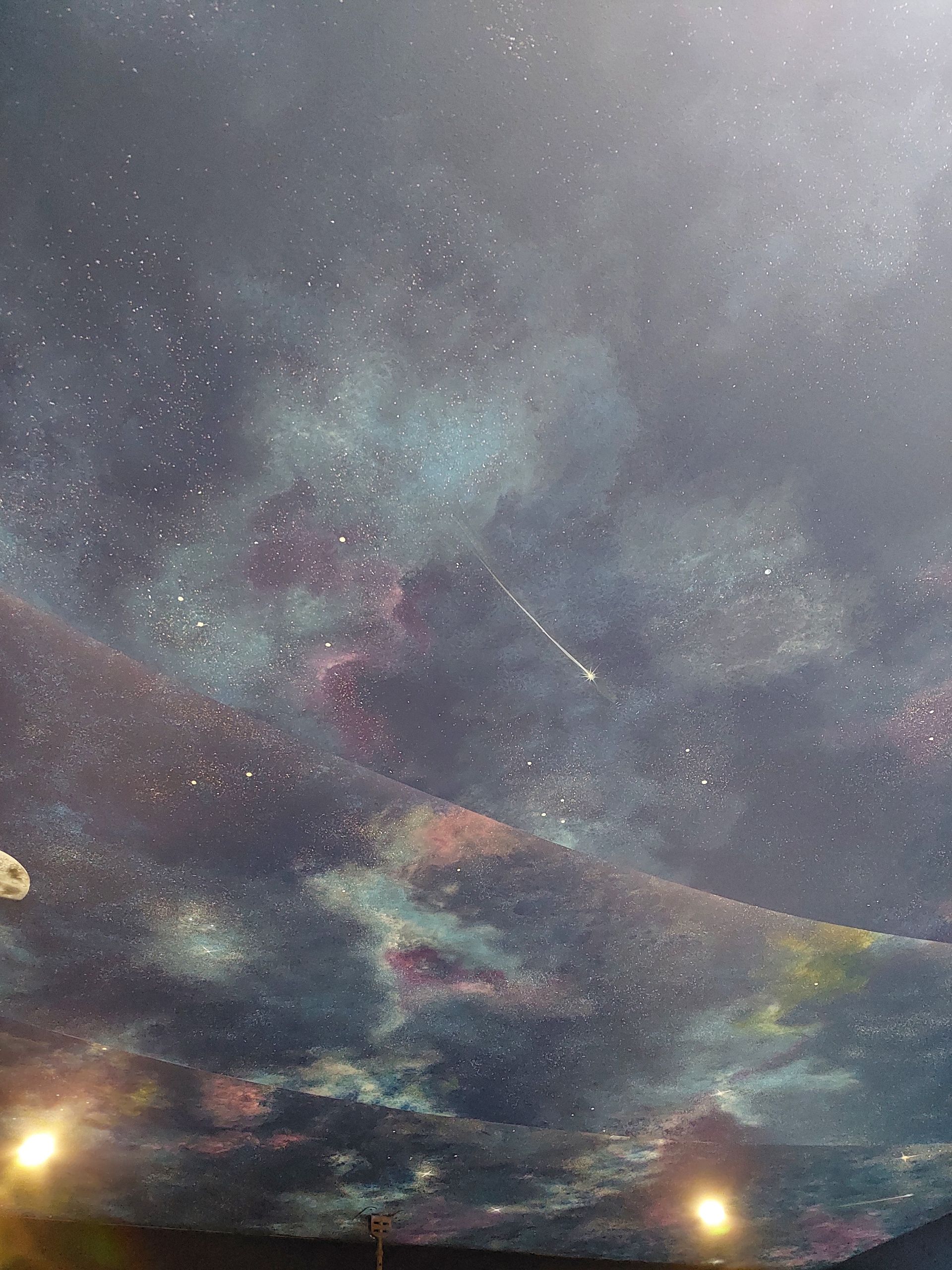 A painting of a night sky with stars and clouds