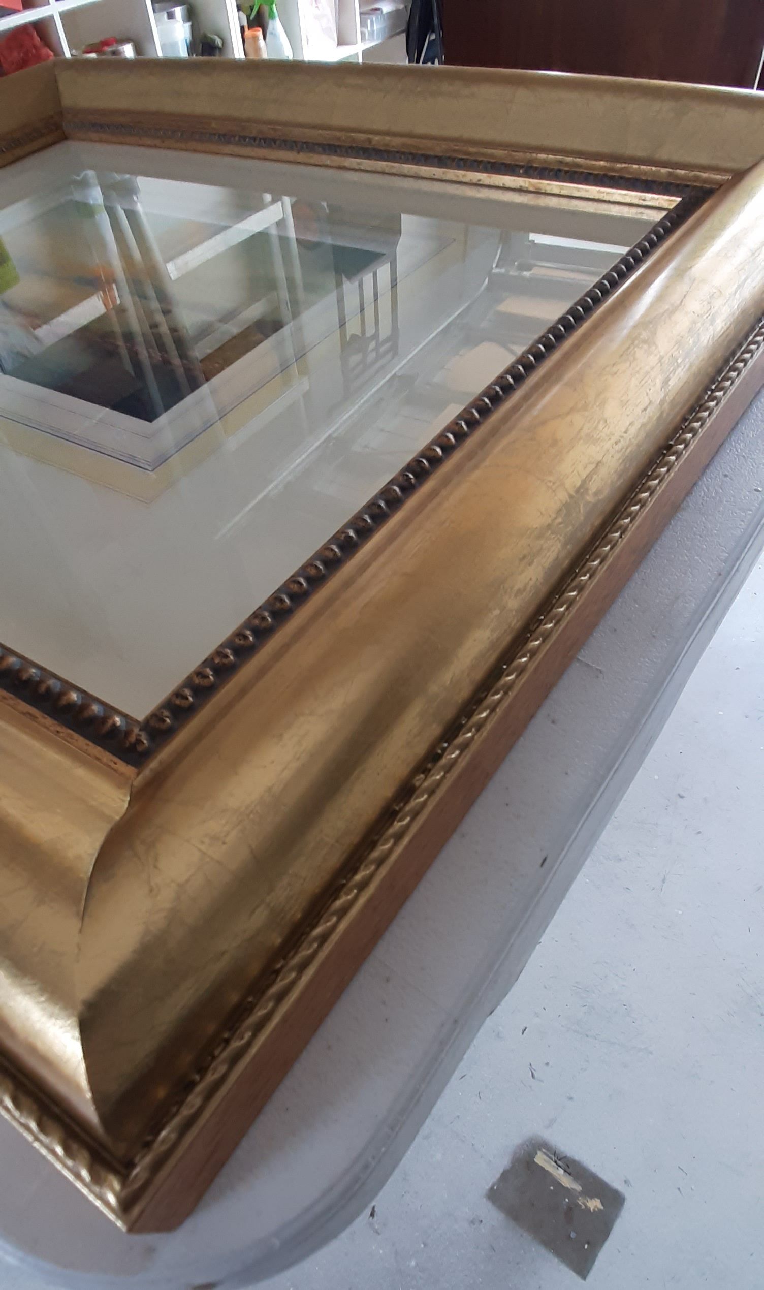 A picture frame is sitting on top of a white table.