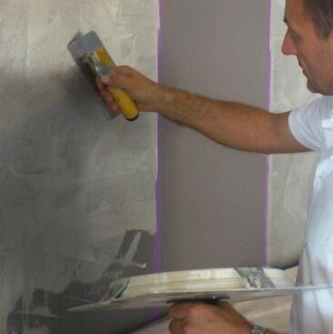 Man Paints The Wall — Artizans International Specialised Paint Finishes in Robina, QLD