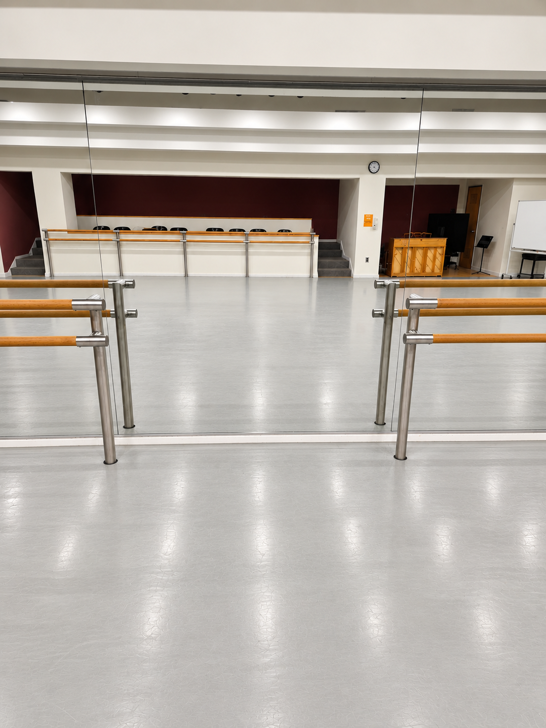 Full wall custom mirror installed in a Baltimore, MD dance studio with ballet barre