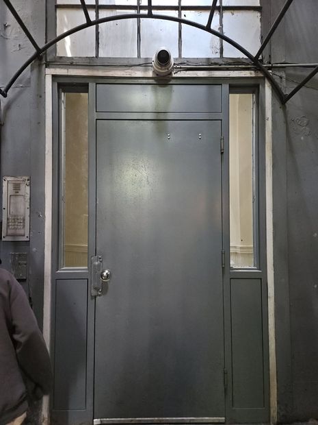 Commercial steel door with glass sidelites and transom in Baltimore, MD