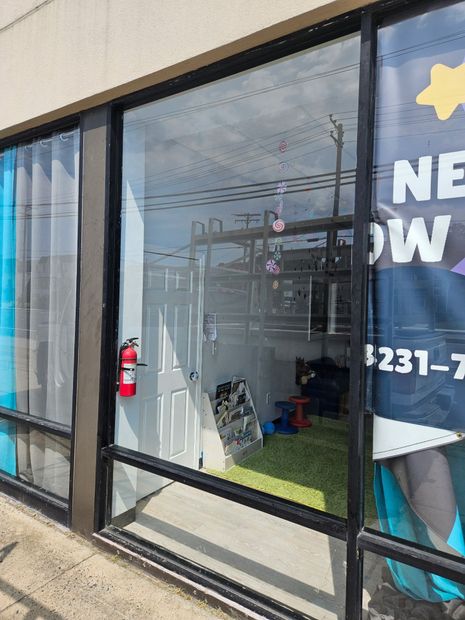 Commercial storefront window glass in a black aluminum frame in Baltimore, MD
