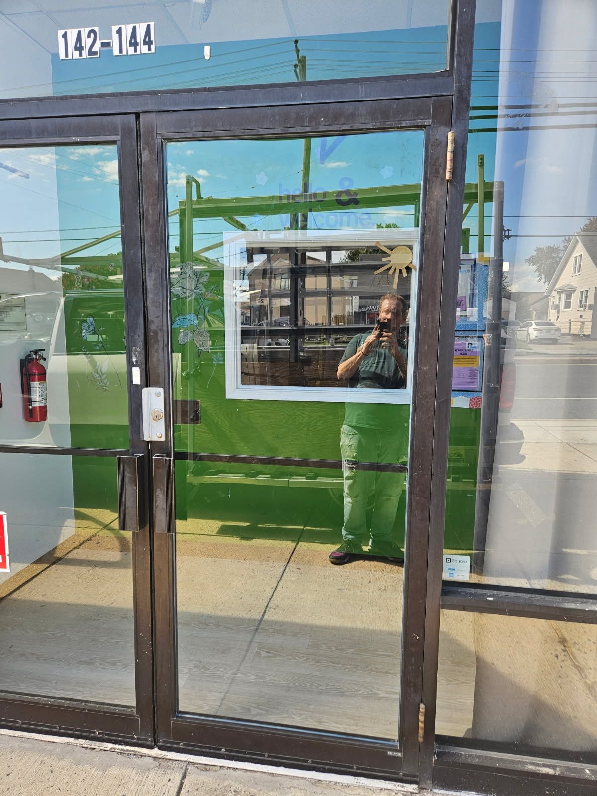 Dark bronze aluminum storefront door and sidelites glass installed by Baltimore Glass Company