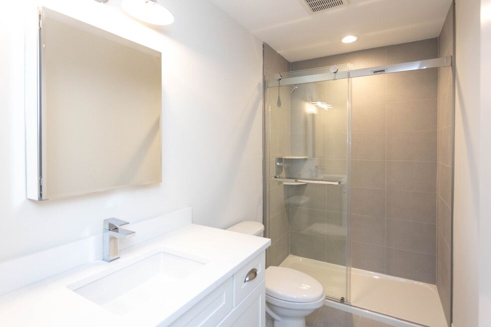 The Stony Brook- Bathroom with bath tub and sink