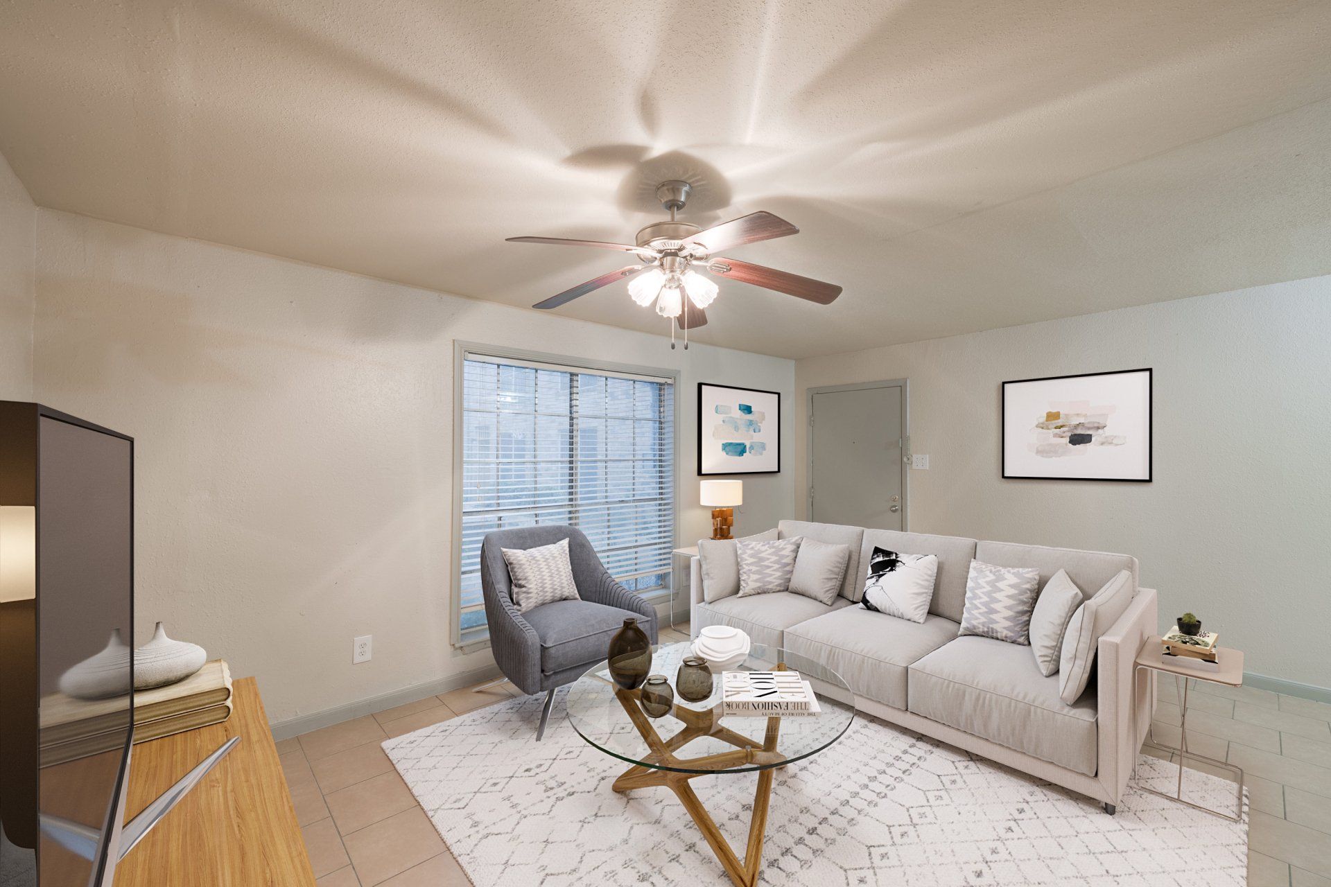Houston apartments for rent modern living room with beige sectional sofa and ceiling fan at  Gia Capital.