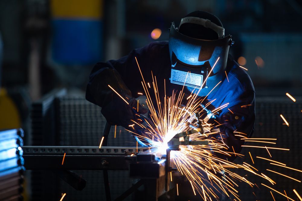 Workers Wearing Industrial Uniforms and Welded Iron Mask at Steel Welding Plants — Hydraulic Repairs in Ballina, NSW