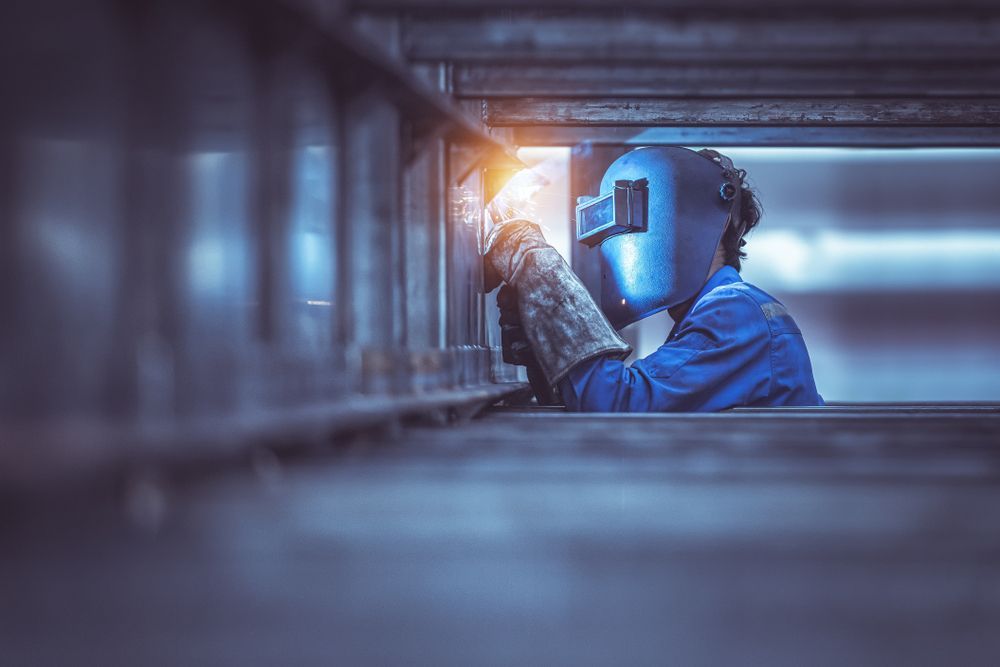 Industrial Worker Labourer at the Factory Welding Steel Structure — Steel & Aluminium Welding in Ballina, NSW