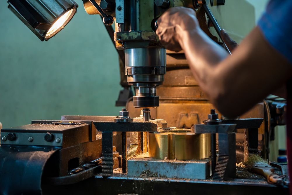 Skilled Technician Operating an NC Milling Machine — Machining & Engineering in Ballina, NSW