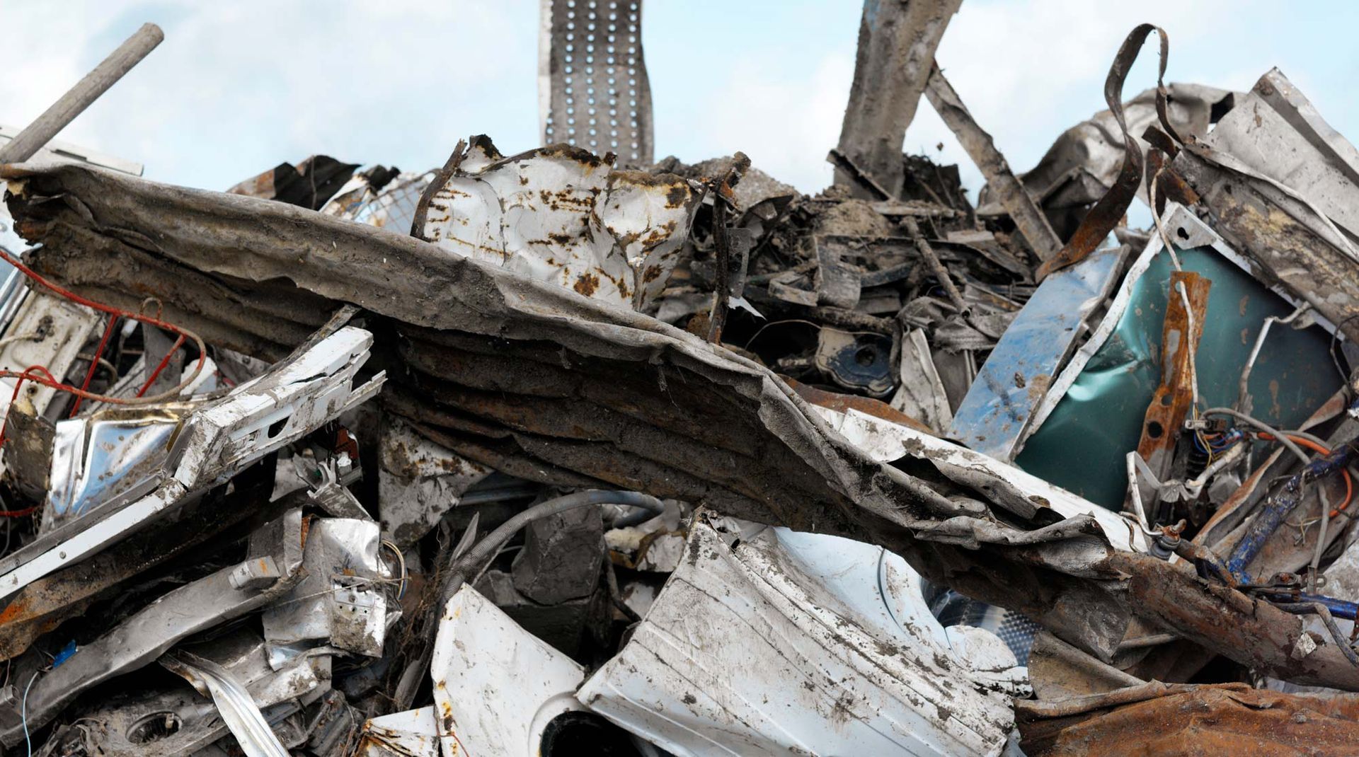A disorganized pile of junk at a metal scrap yard in Alsip, IL, showcasing various discard