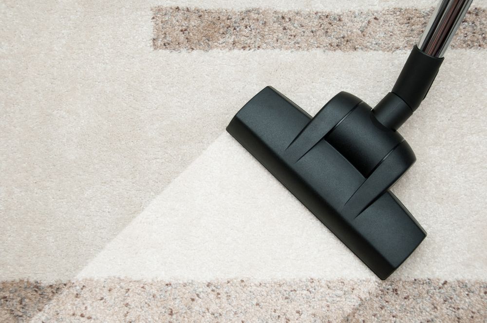 Vacuum Cleaner Nozzle Cleaning a Light-Colored Carpet — Broadbeach Carpet Cleaning In Mermaid Beach, QLD