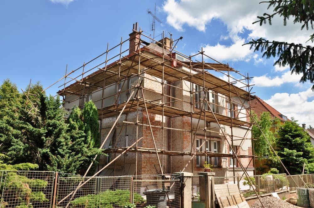 A House Is Being Remodeled with Scaffolding on The Side of It — Edwards & Froud Building Services Pty Ltd in Quirindi, NSW