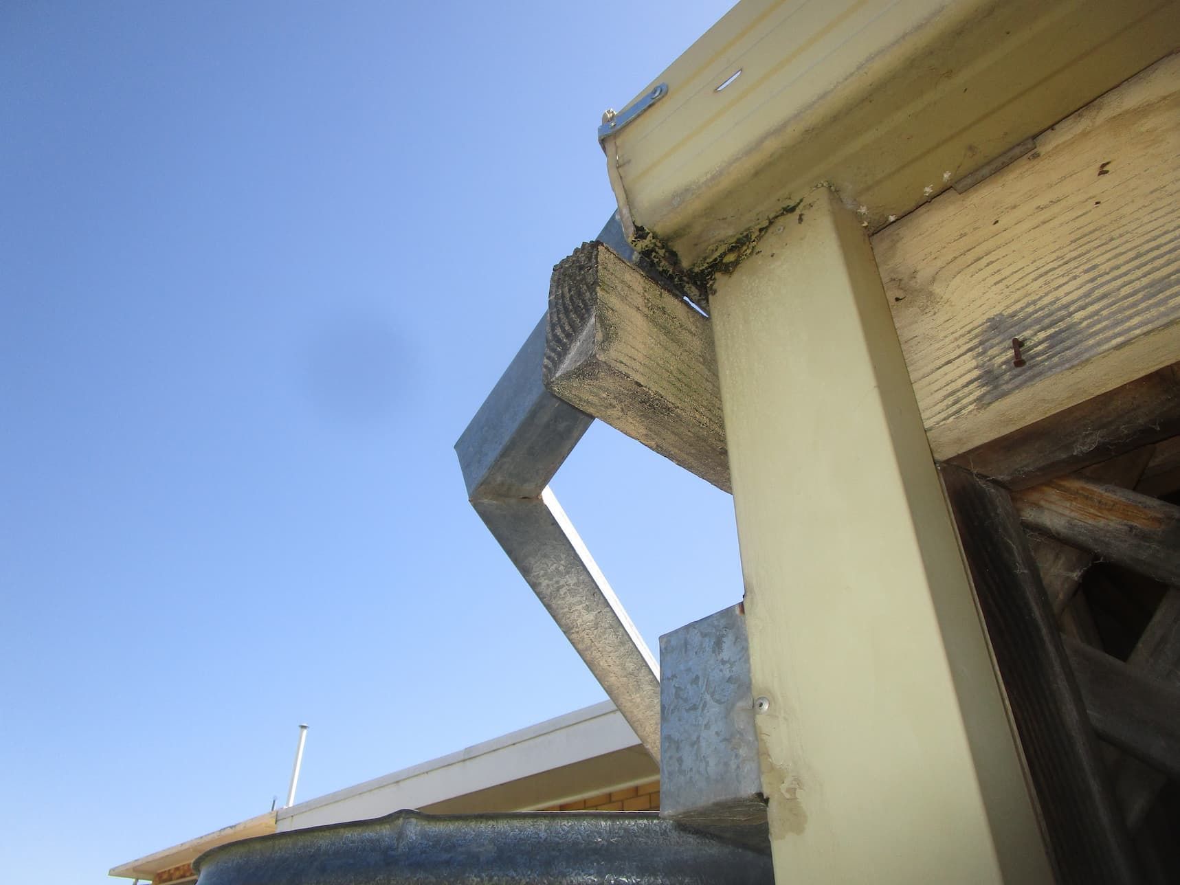 A Close up Of a Gutter on A Building with A Blue Sky — Edwards & Froud Building Services Pty Ltd in Narrabri, NSW