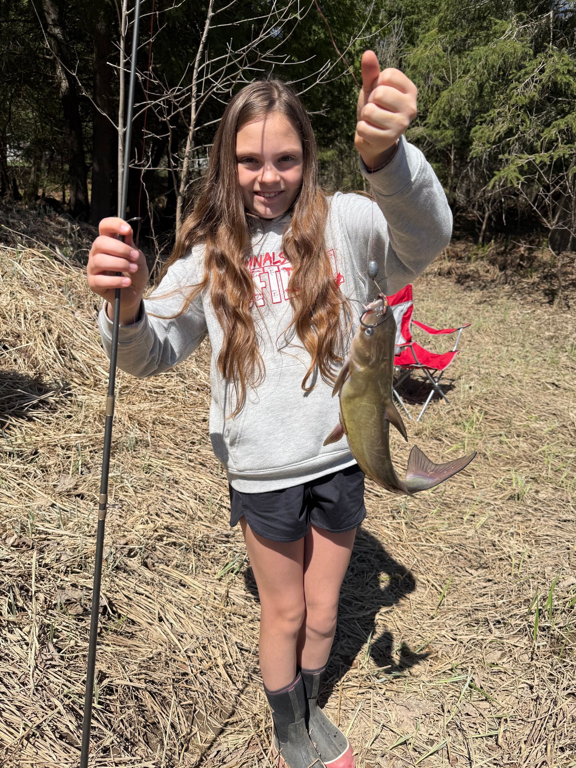 2025 Local Catch Winner Mia Hakala, holding the catfish she caught on the St Louis River. Sponsored by Floe.