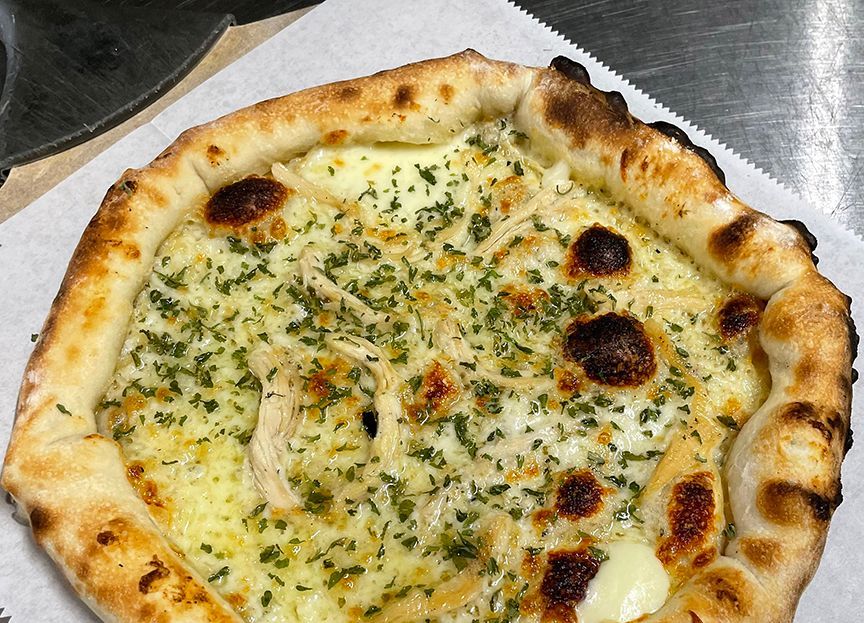 Pizza with mozzarella stuffed crust, garlic parmesan crust, 5-cheese blend, chicken, garlic oil, parsley