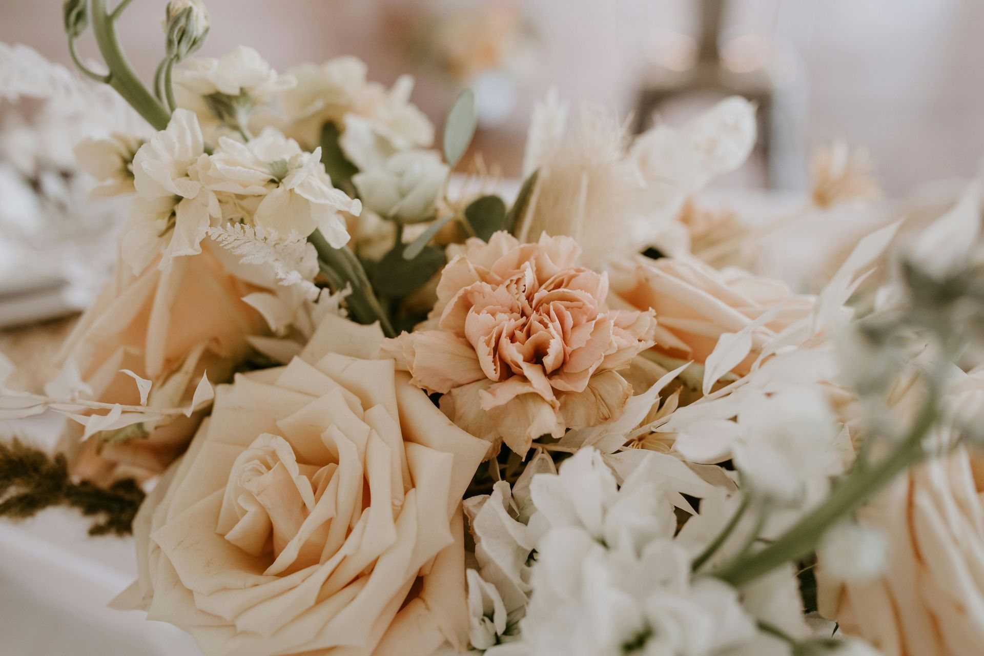Cream and white roses with a peach carnation bouquet