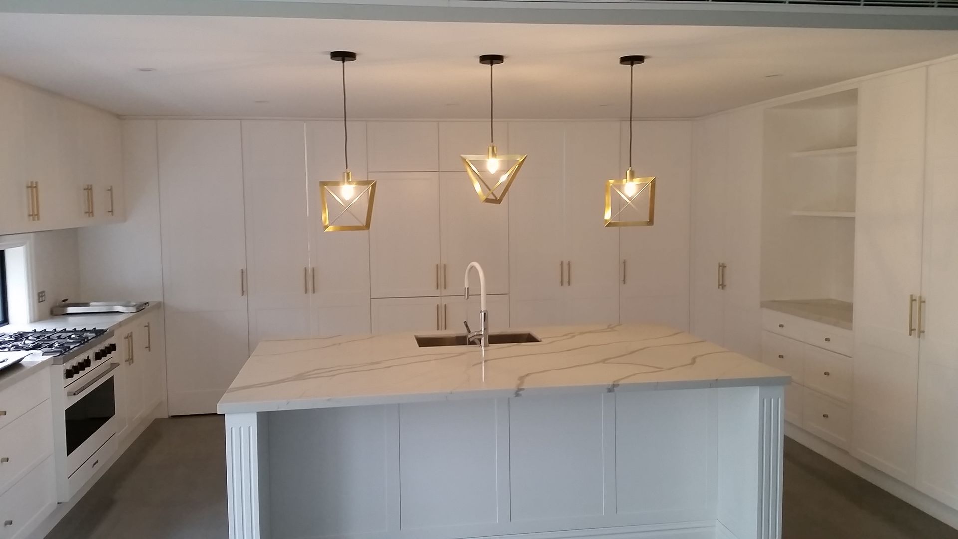White kitchen that has had plumbing services recently.— All About Quality Plumbing Services In Halekulani, NSW