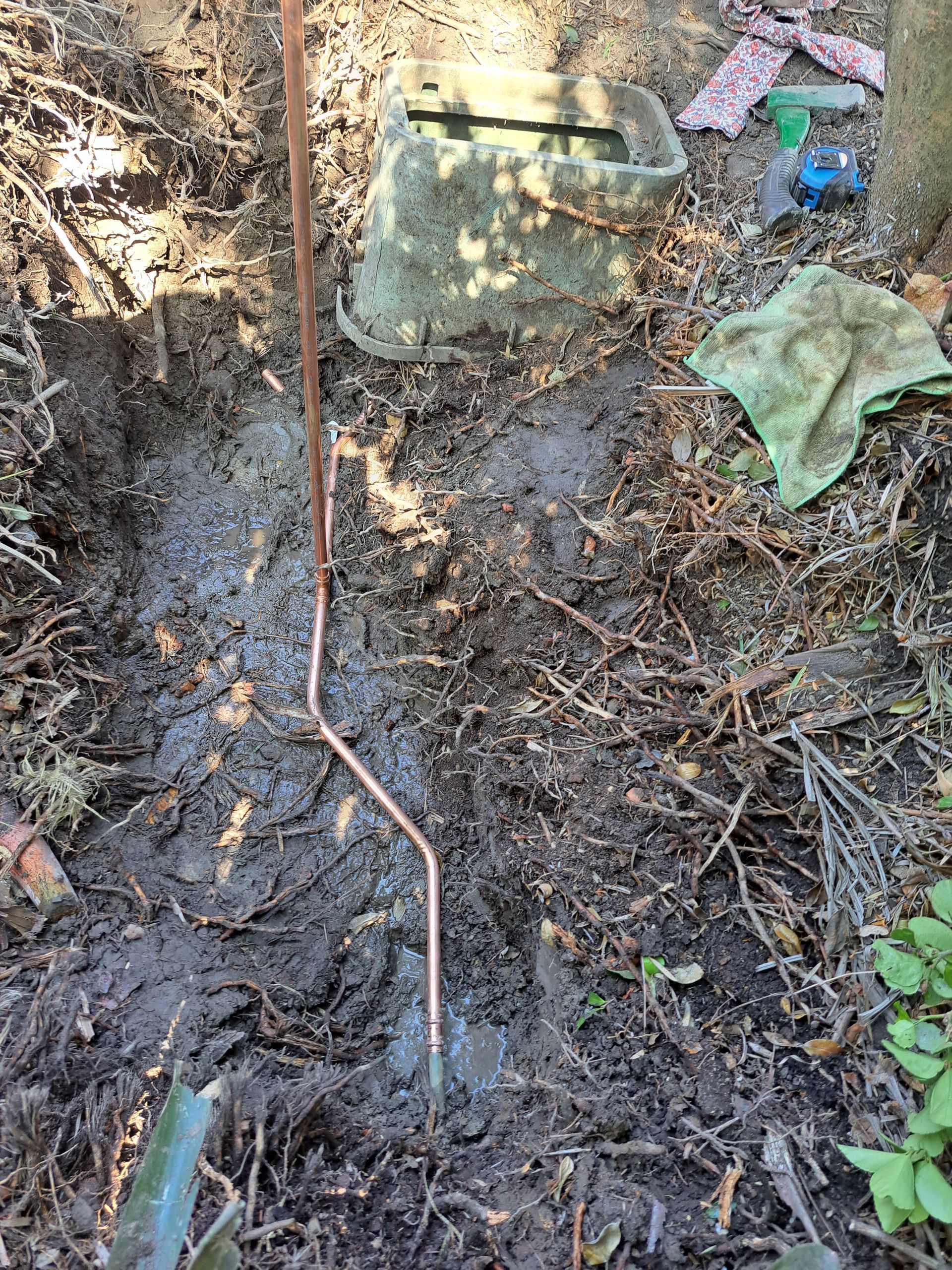 A Person is Using a Drain Snake to Clean a Sink — All About Quality Plumbing Services In Halekulani, NSW