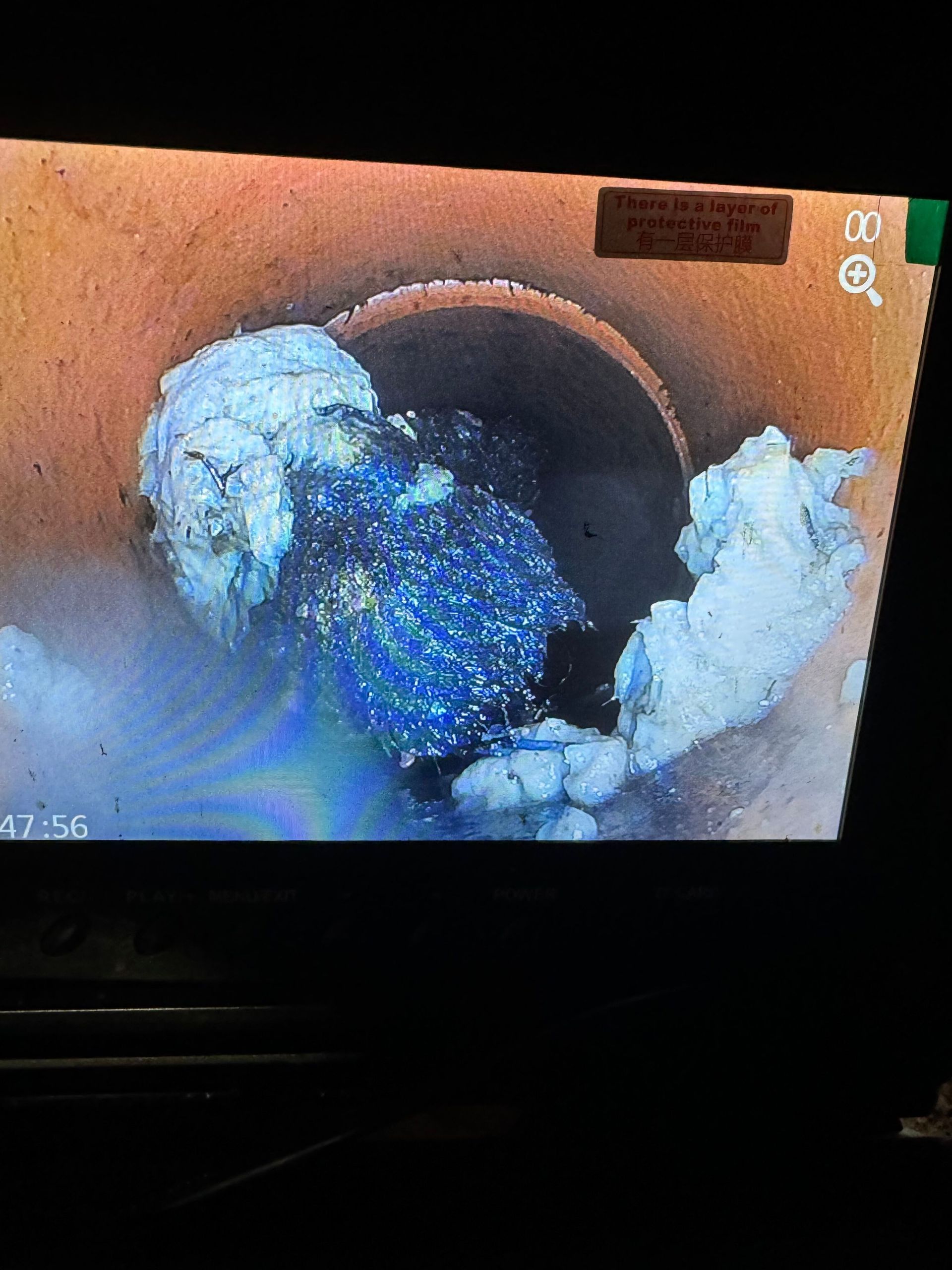 A Plumber is Fixing a Sink With a Wrench — All About Quality Plumbing Services In Halekulani, NSW