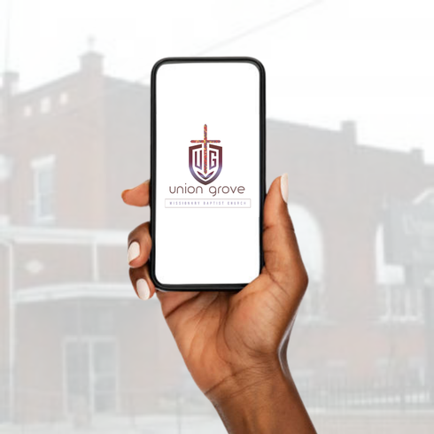 Hand holding smartphone displaying Union Grove logo against a blurred building background