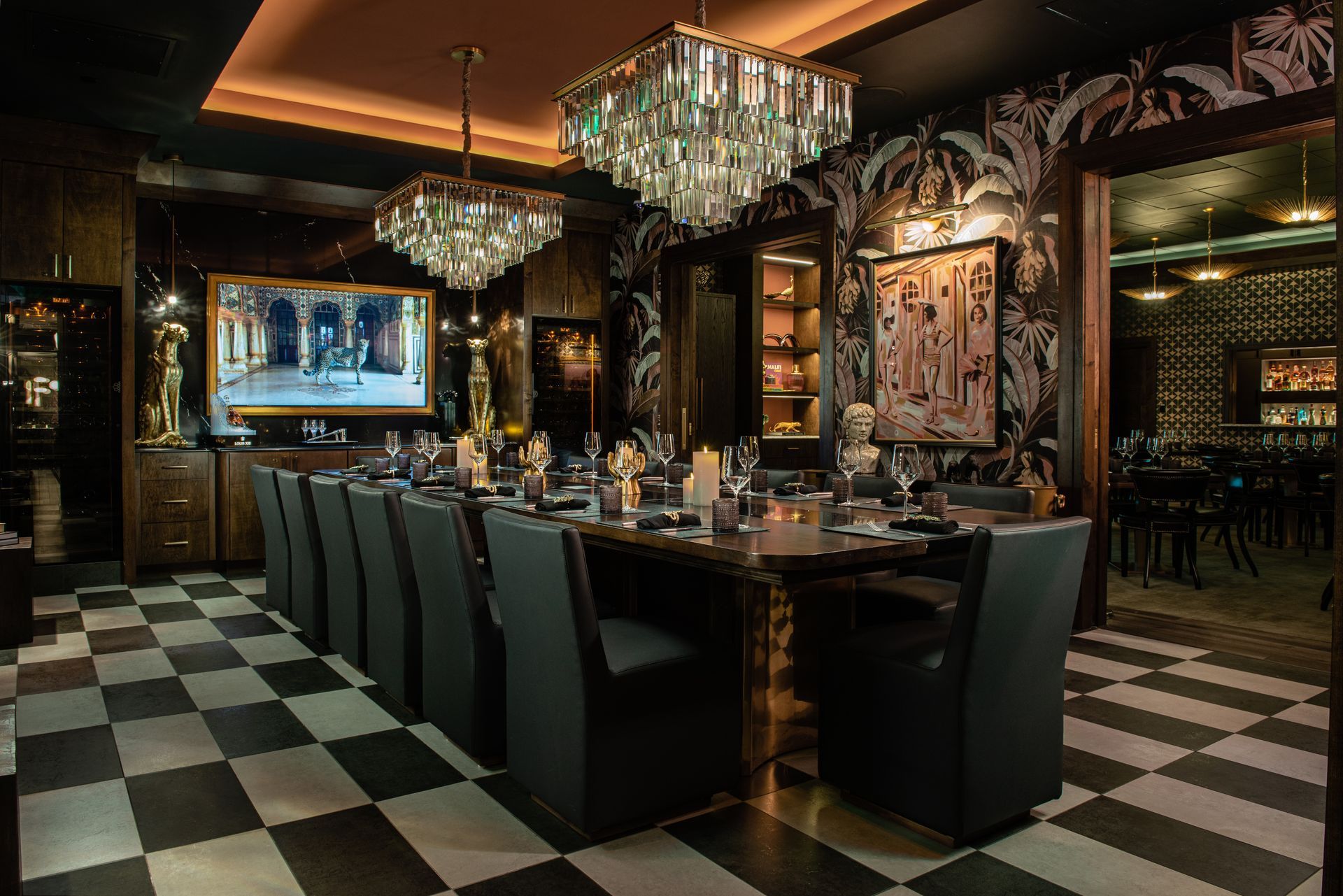 A dining room with a long table and chairs and a checkered floor. Private Dining Room at Timpano Las Olas