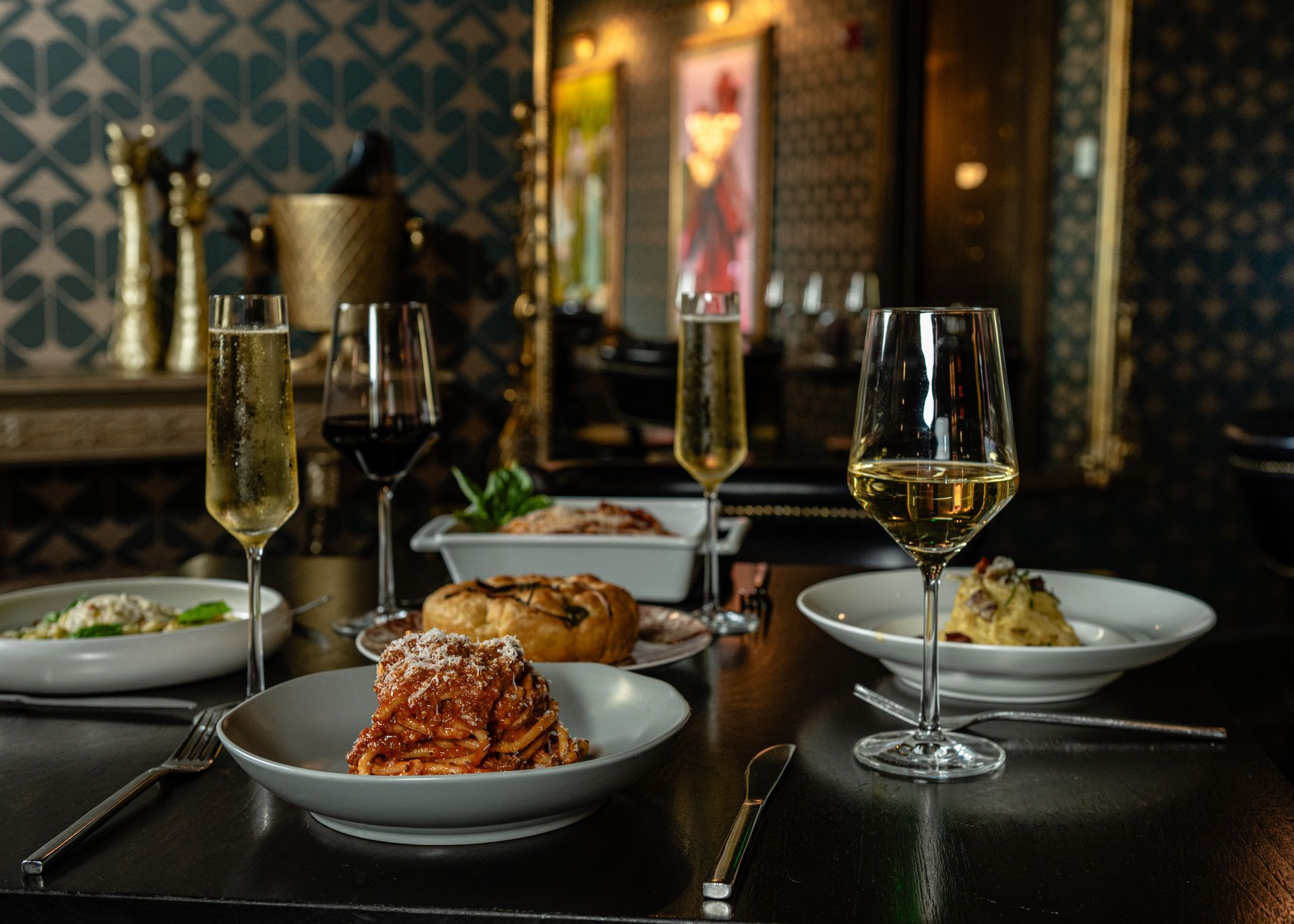 table setting with dinner and wine