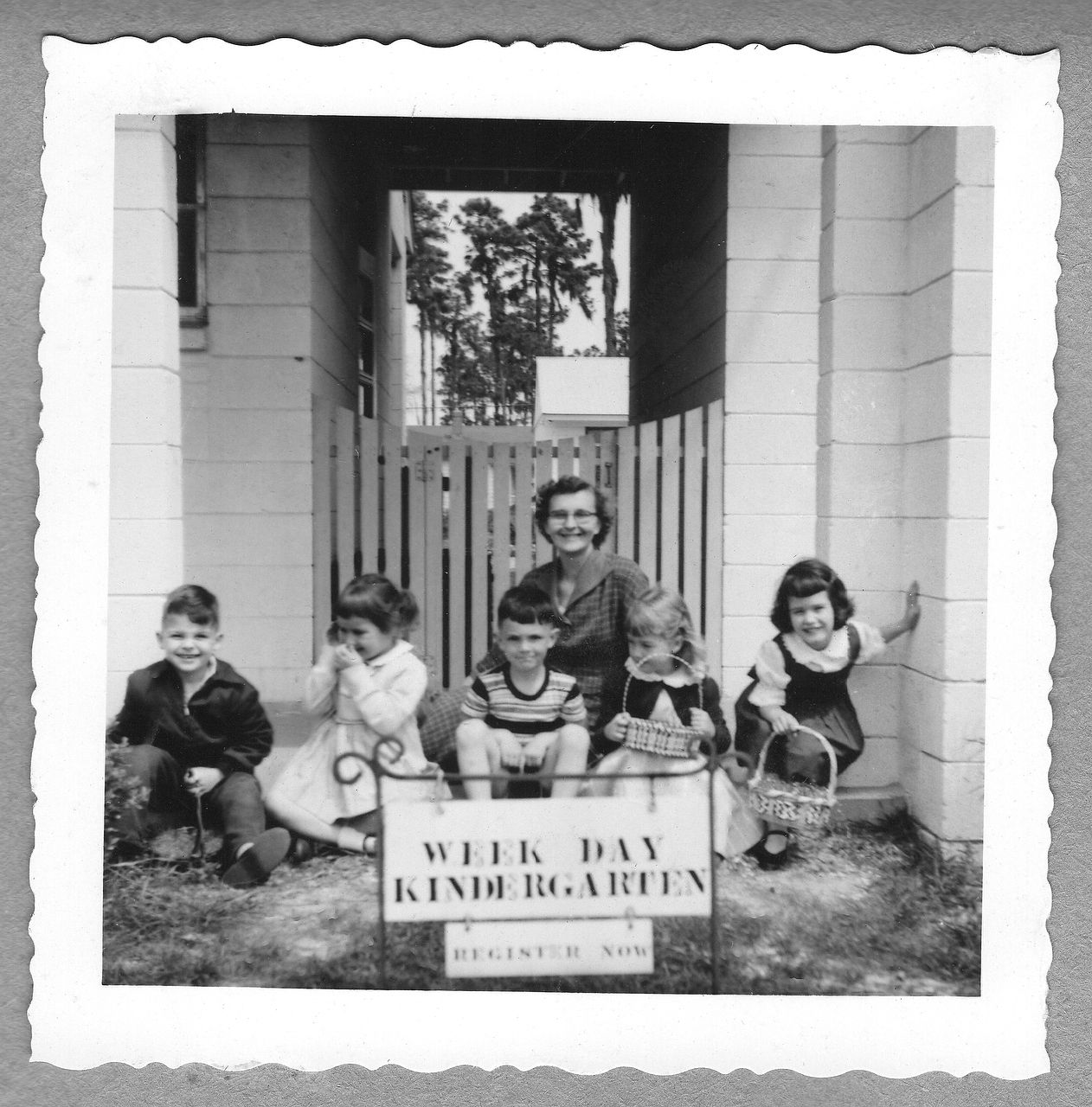 Children with teacher in front of 