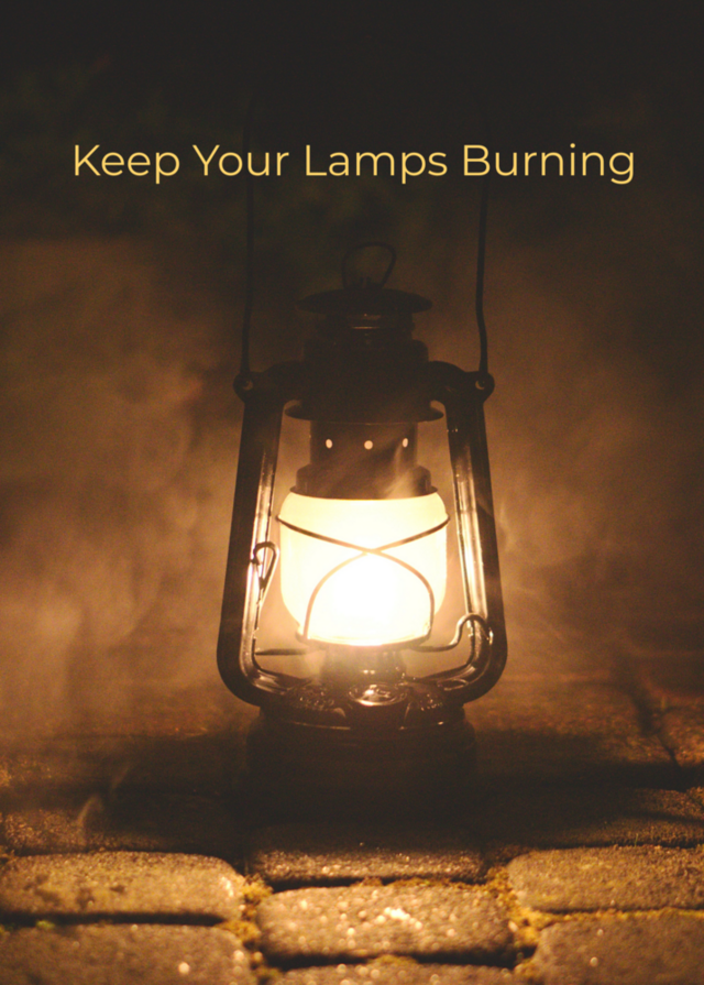 A lit lantern sits on a dark stone path, with the text