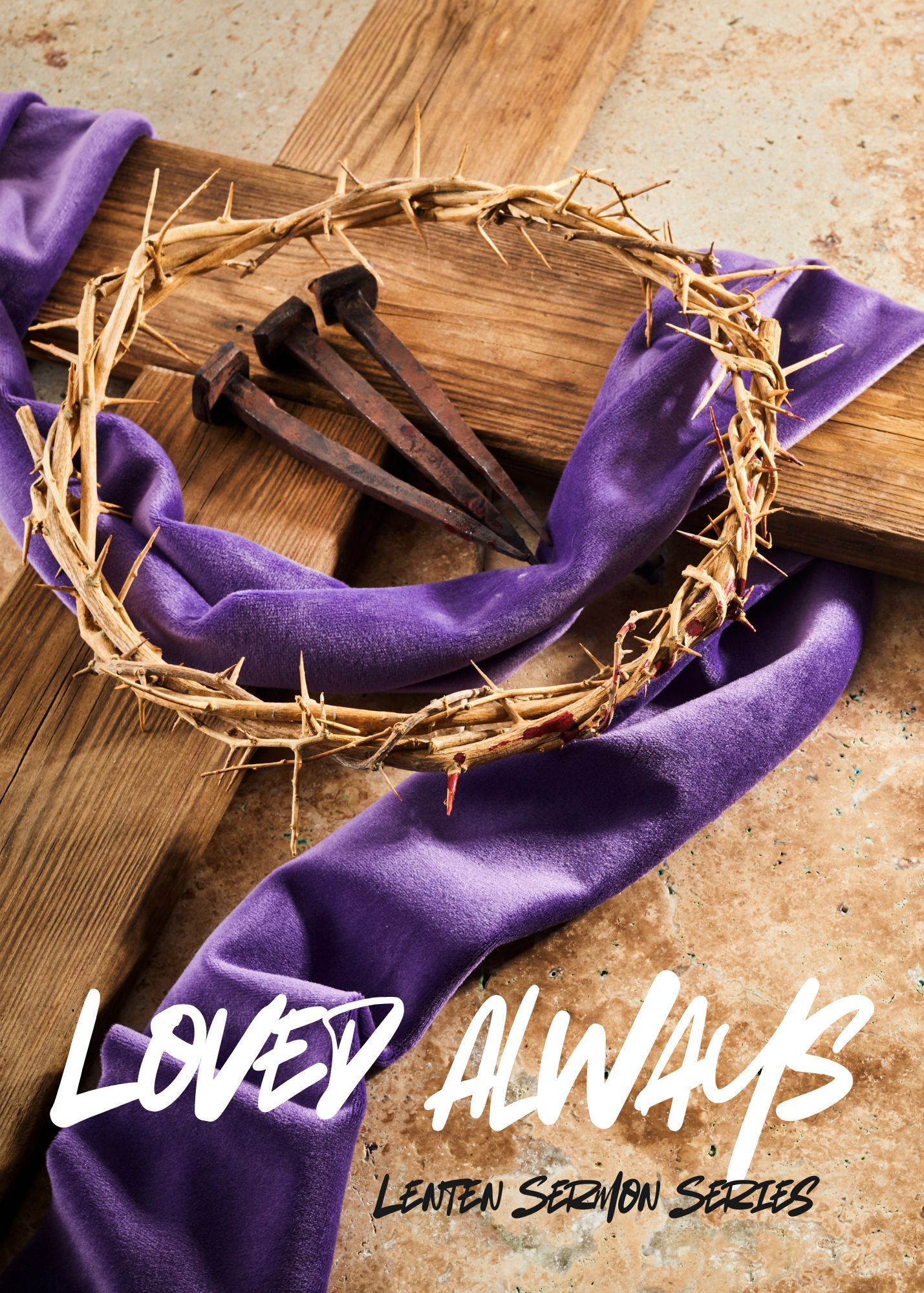 A crown of thorns and three nails lie on a purple cloth draped over a wooden cross, with the text