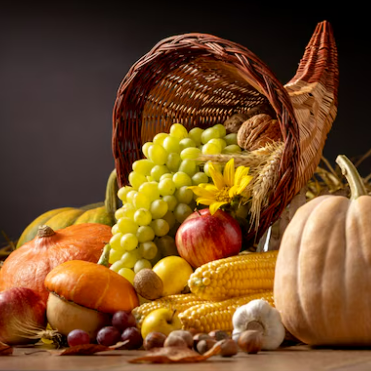 Cornucopia overflowing with fruit and vegetables: grapes, apple, corn, and pumpkins.