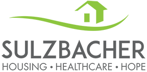 Logo for Sulzbacher: green house icon above text