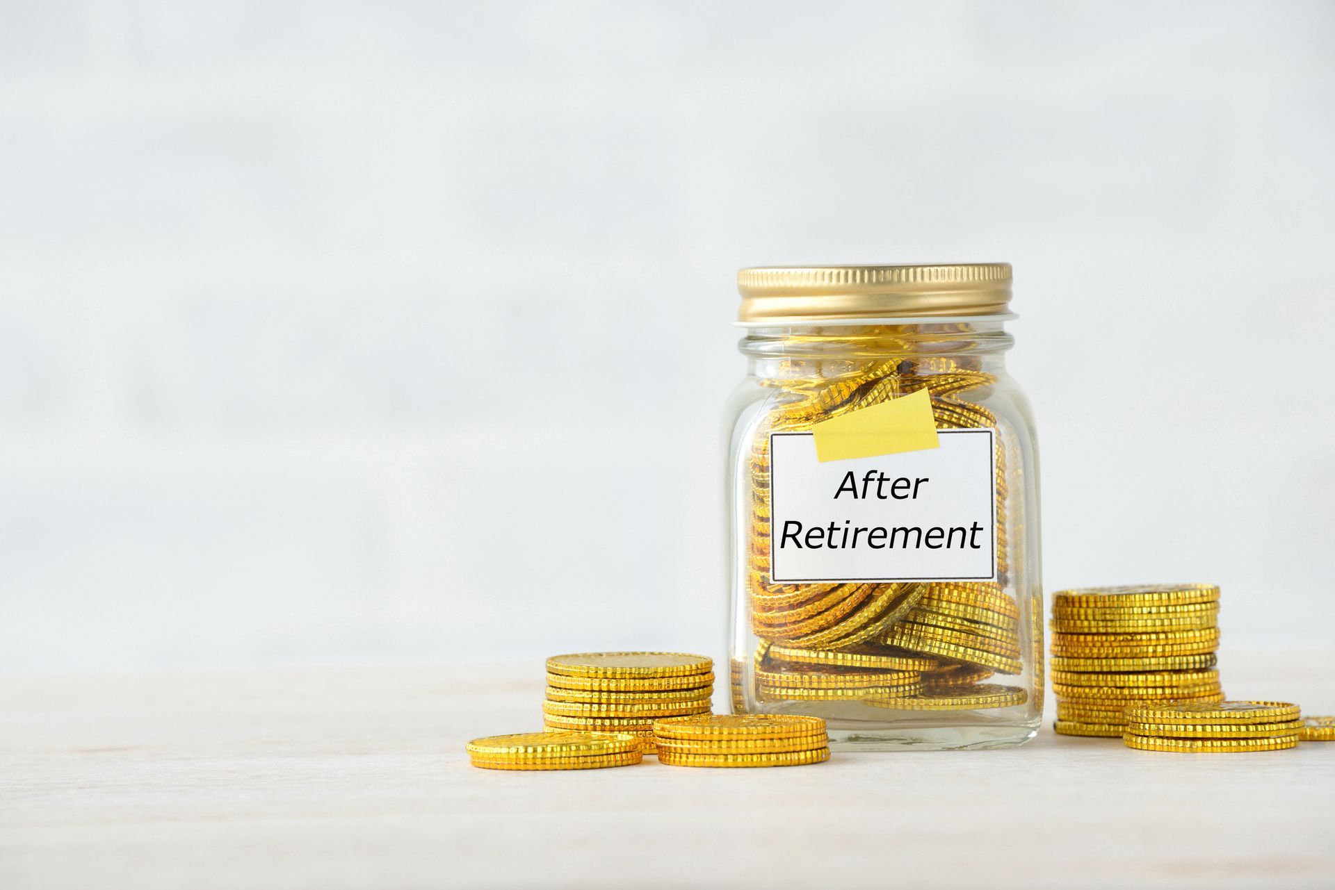 A jar filled with gold coins and a note that says `` after retirement ''.