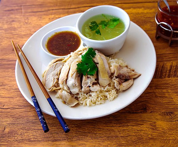 Khao Man Gai Thai chicken and rice dish served with garlic-ginger rice and dipping sauce at My Thai 