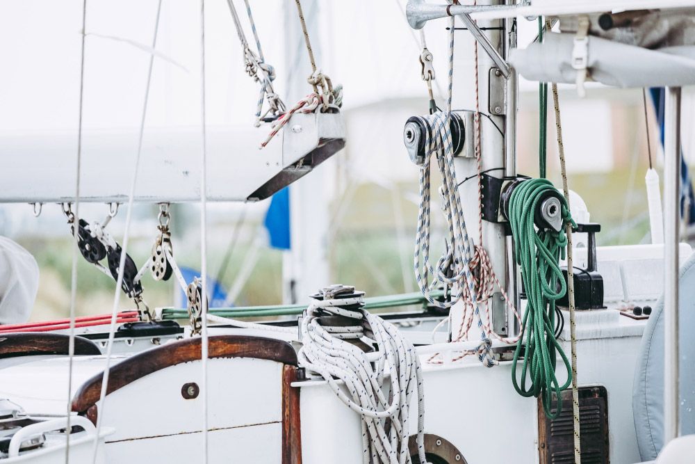 A Close up Of a Sailboat with Ropes Hanging from It — Ashby Boat Builders In Buddina, QLD