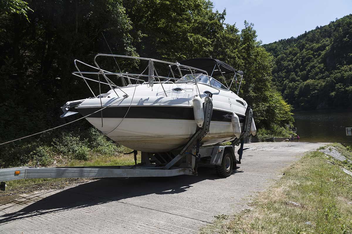 A Boat Is Being Towed Down a Road by A Trailer — Ashby Boat Builders In Buddina, QLD