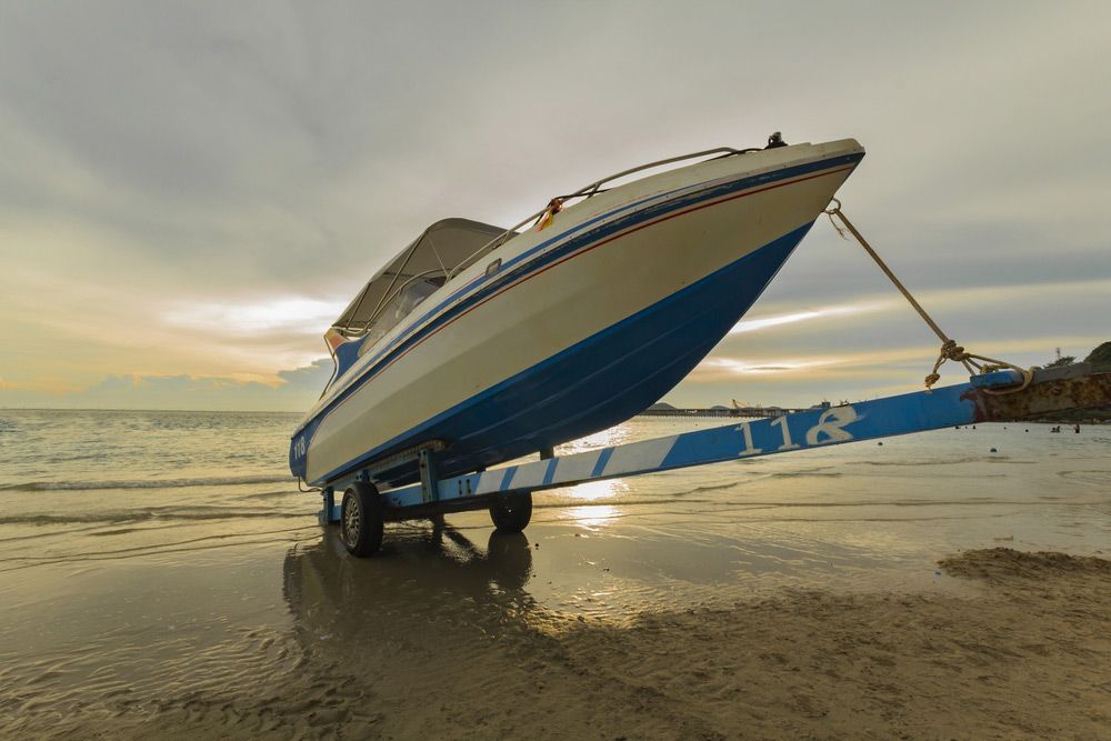 A Boat on A Trailer with The Number 118 on It — Ashby Boat Builders In Buddina, QLD