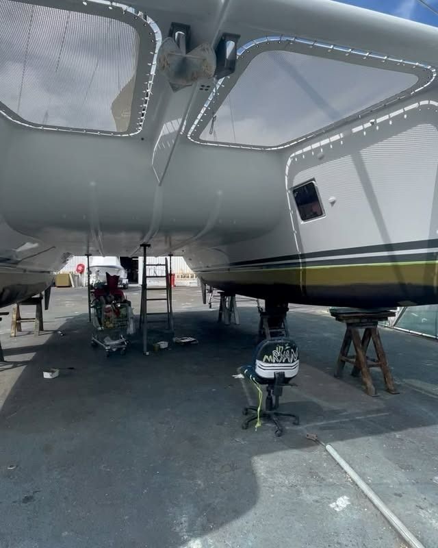 A Large White Boat Is Parked in A Parking Lot — Ashby Boat Builders In Buddina, QLD