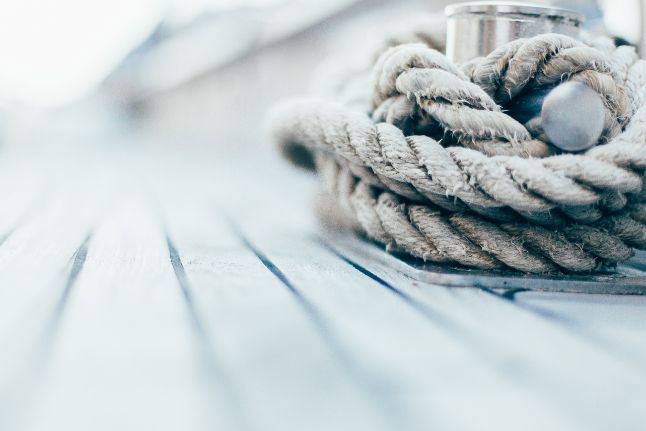 A Close up Of a Rope on A Wooden Deck — Ashby Boat Builders In Buddina, QLD