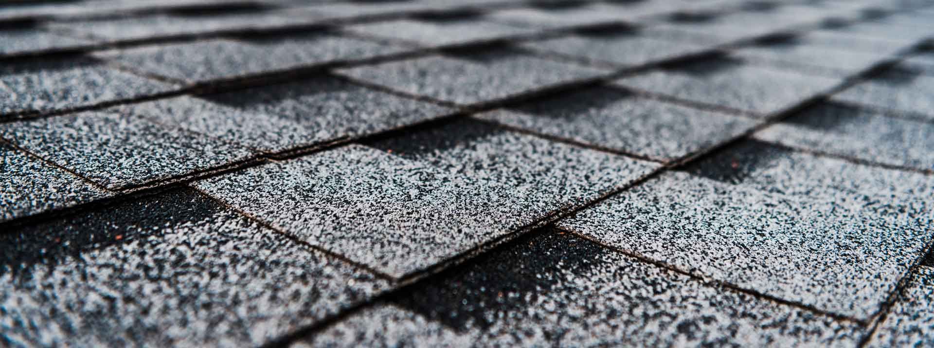 Close-up of a gray asphalt shingle roof.