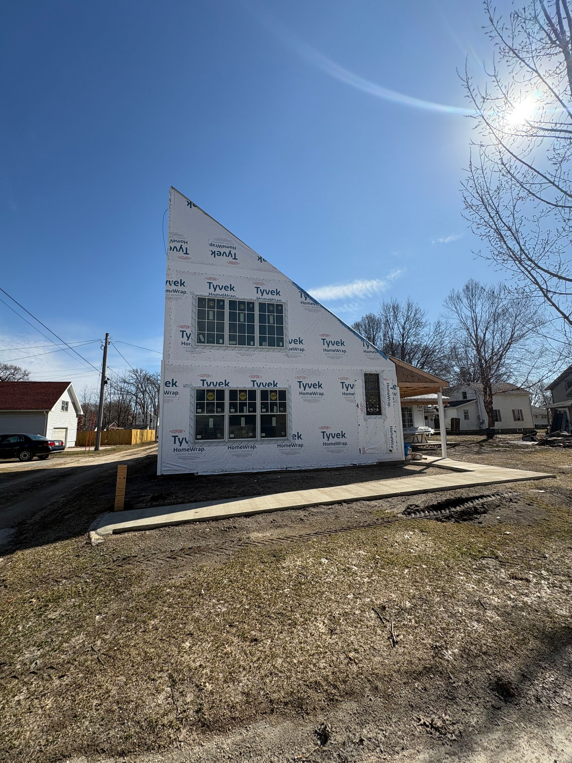 A view of a custom home addition with window installation in Lansing, Iowa.